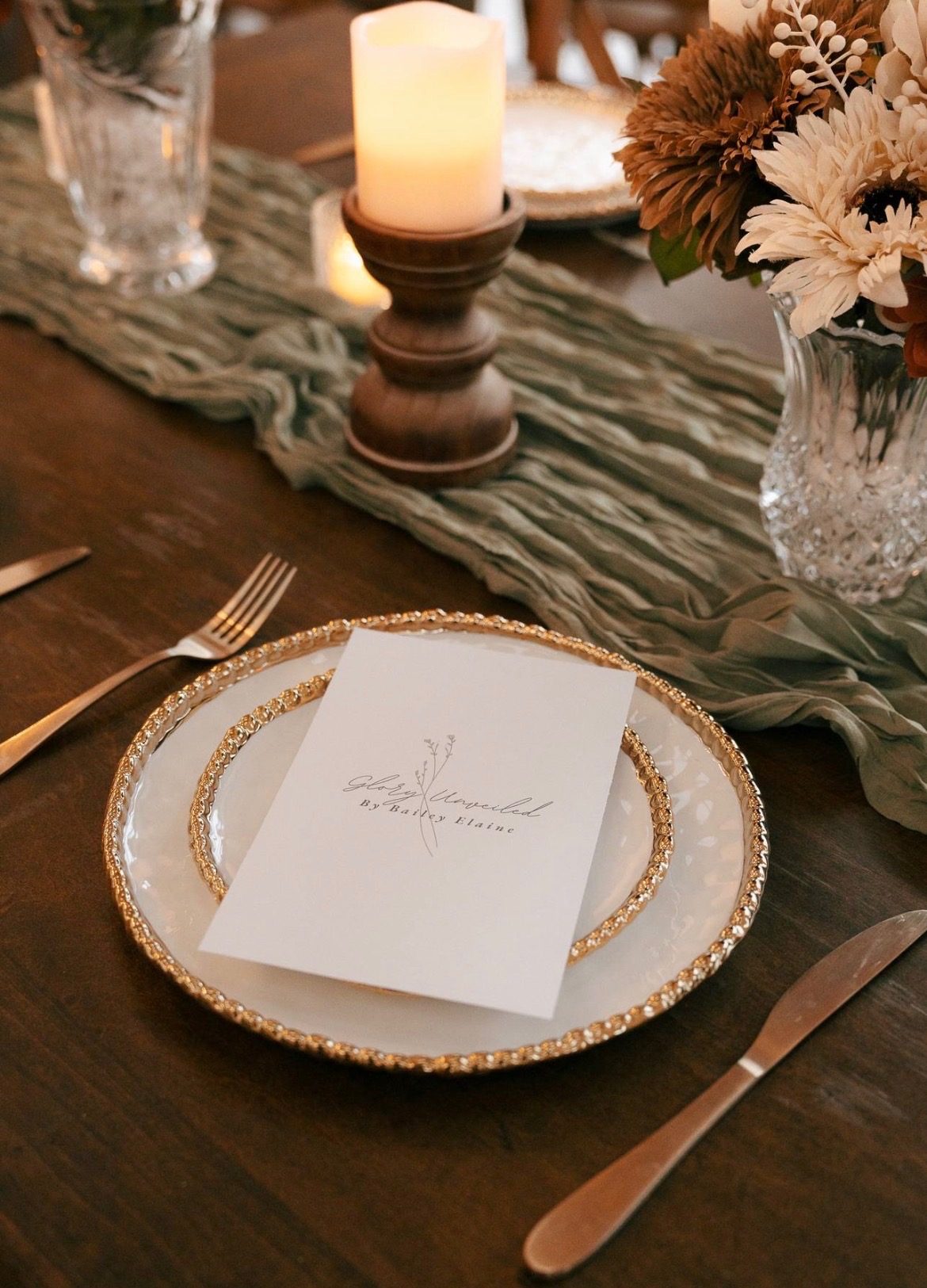 Glory Unveiled menu card styled with candlelight and dried florals