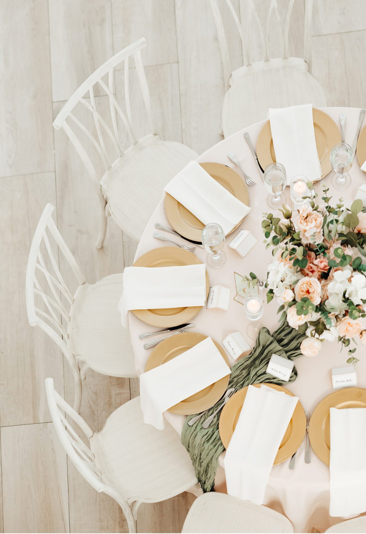 Overhead view of a place setting with menu card and candlelight